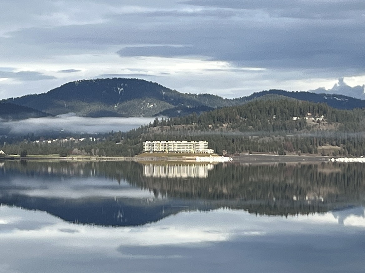 Julie Beguelin took note of the mirror-like waters of Coeur d’Alene Lake.