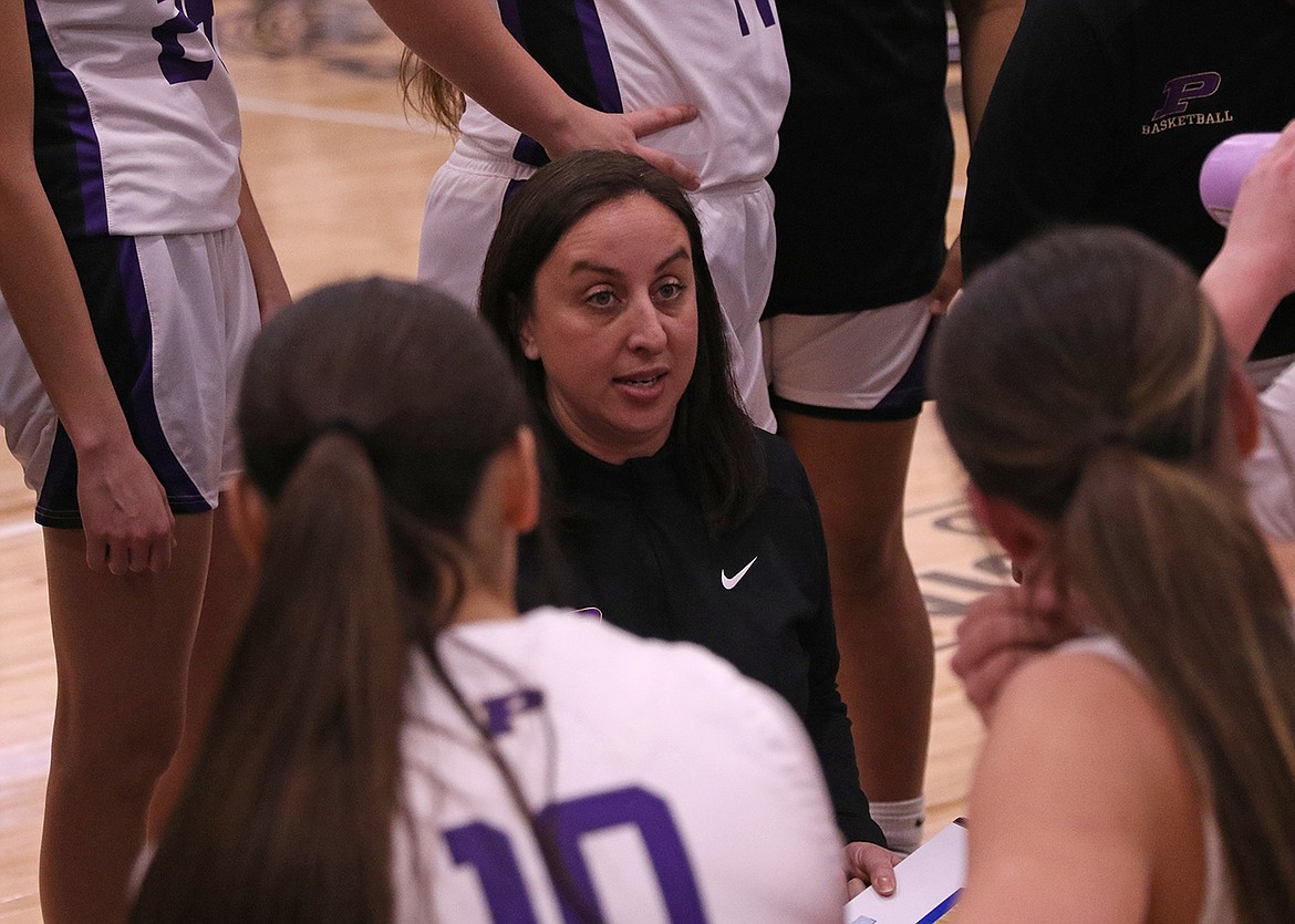 Coach Brandie Buckless rallies the Lady Pirates toward their first win in a decade against Columbia Falls in late January. (Bob Gunderson photo)