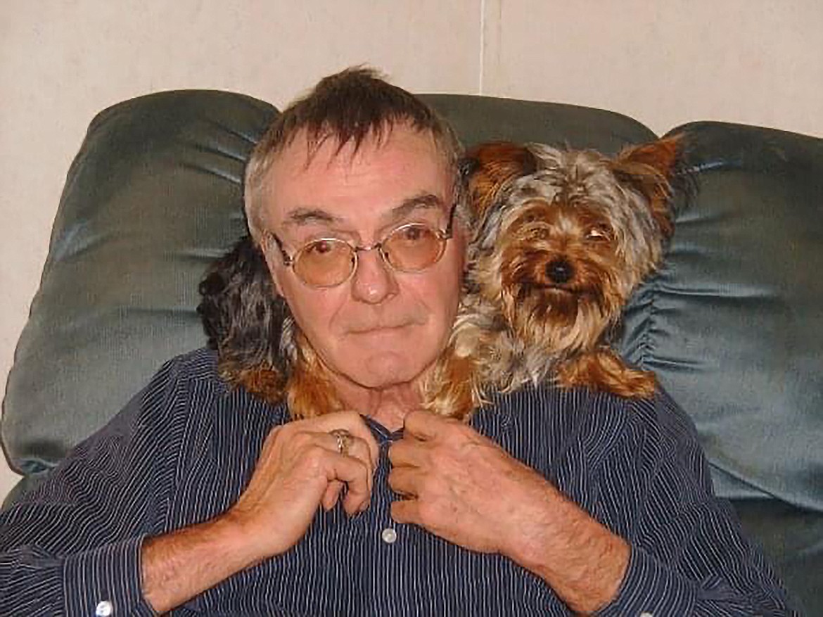 David Flaget sits with a puppy he'd just adopted shortly before he was killed by James Russell.