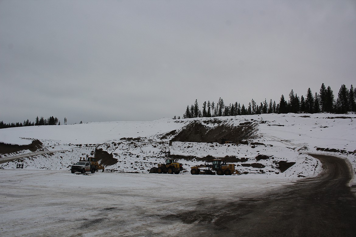 A gravel pit on private property near the Tarkio exit on I-90 is bustling with Knife River equipment. The company is stockpiling gravel in Missoula to use for the upcoming season and will continue to do so through early spring. (Monte Turner/Mineral Independent)