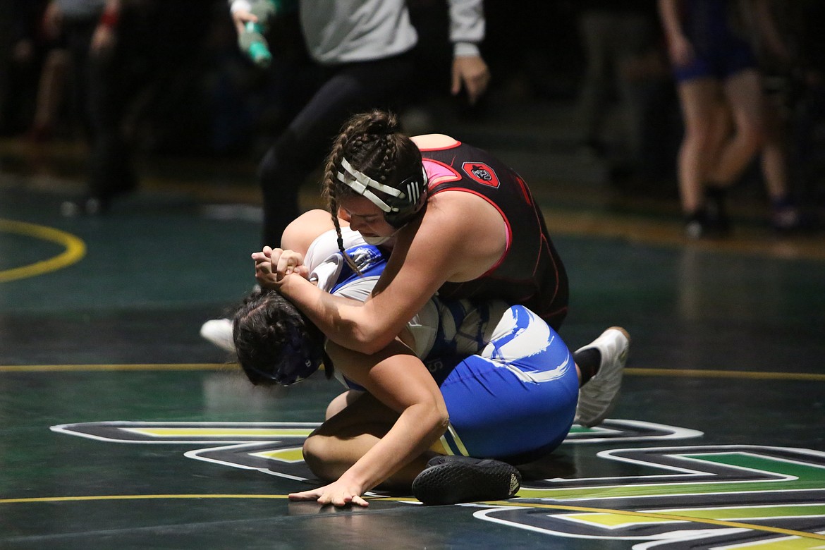 Othello junior Elia Velazquez, top, finished atop the 190-pound weight class at Quincy’s Bring Home Da Beef girls wrestling tournament on Saturday.