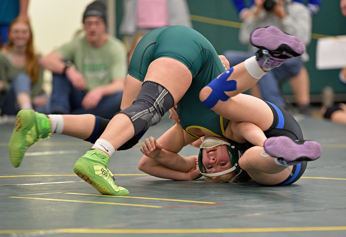 Whitefish freshman Sam Bennetts wrestles Wildkat Jaici Watt at the Whitefish Duals on Friday afternoon. (Whitney England/Whitefish Pilot)