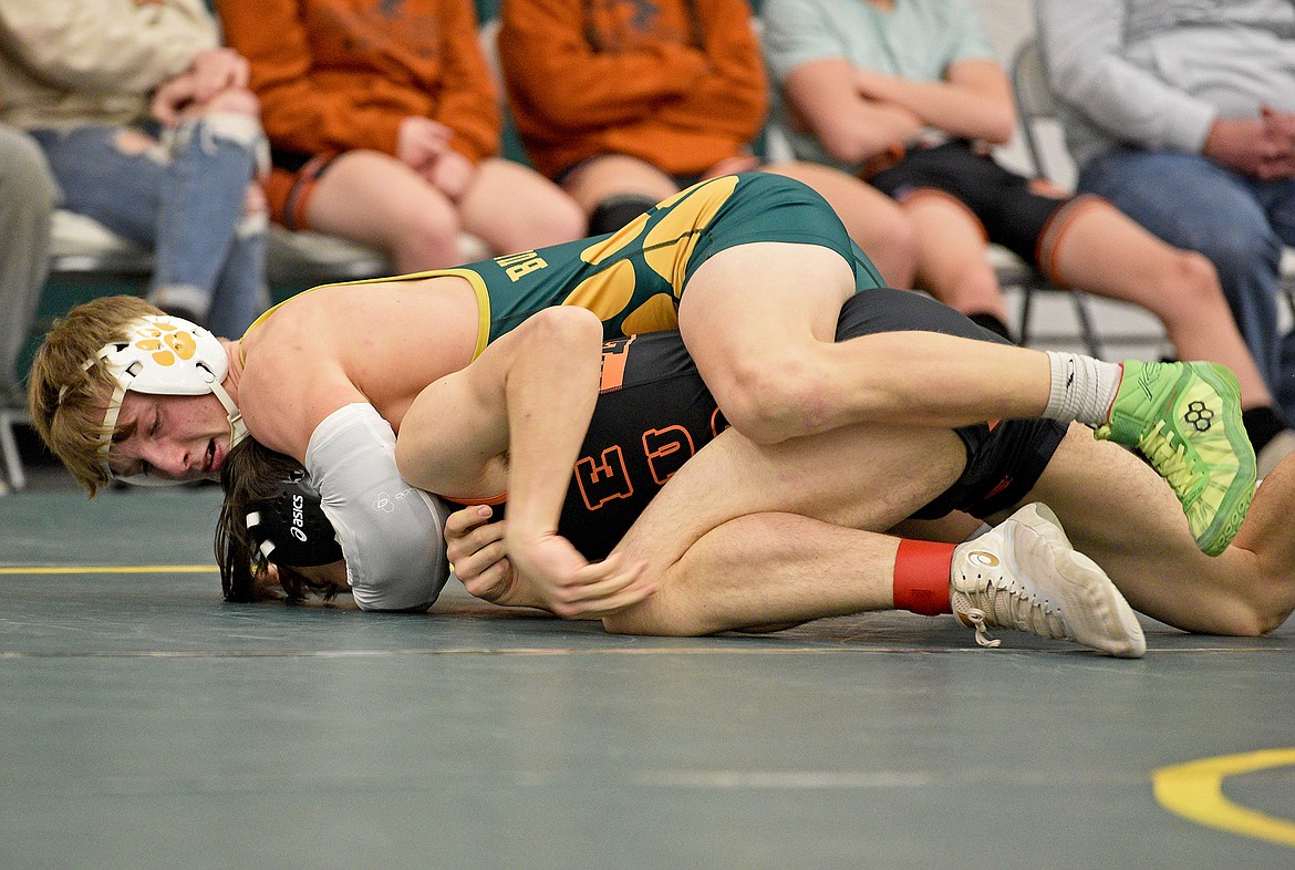 Bulldog Henry Bennetts wrestles Eureka's Michael Watters at the Whitefish Duals on Friday afternoon. (Whitney England/Whitefish Pilot)