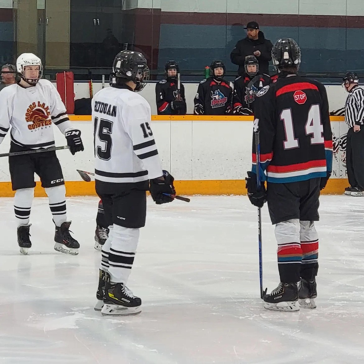 Moses Lake Coyote’s Mason Solders, left, and Brayden Buduan prepare for a face off against Kelowna.