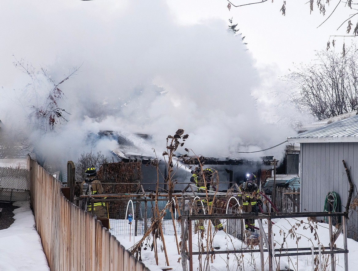 Firefighters responded to a house fire on Fourth Avenue West. (Chris Peterson photo)