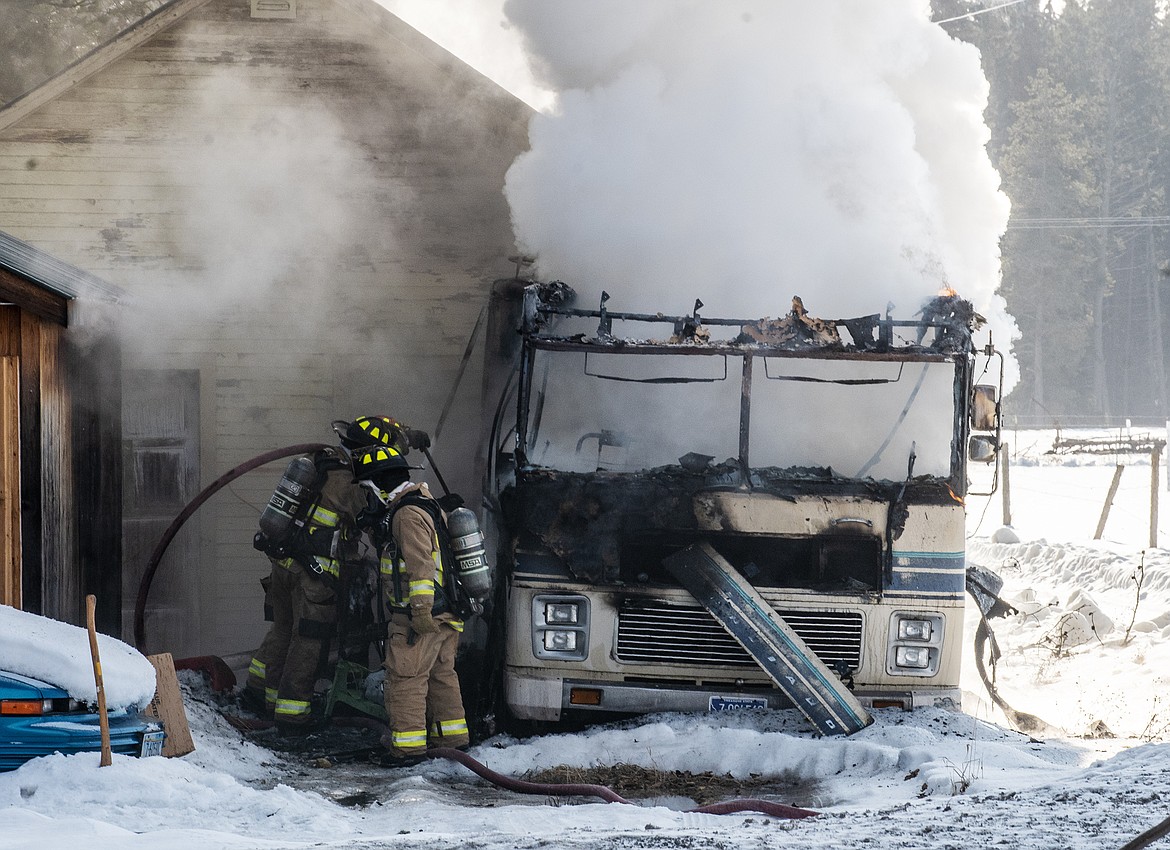 This camper a man was living in was destroyed by a fire Monday afternoon on Highway 40. (Chris Peterson photo)