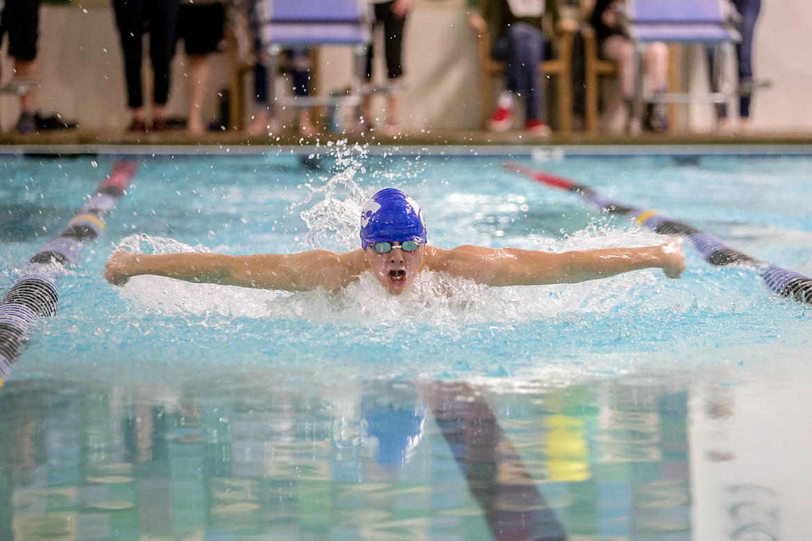 Columbia Falls senior Adam Schrader competes in the 100 butterfly at the Wave in Whitefish on Friday. (JP Edge photo)