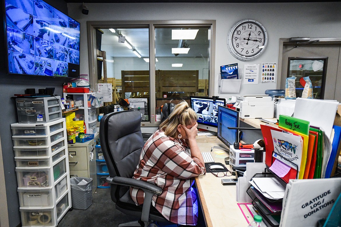 Resource coordinator Jody Waggener receives a phone call informing her that a former elderly guest of the Flathead Warming Center who had found a new, permanent housing situation just one week ago had passed away on Wednesday, Feb. 1. (Casey Kreider/Daily Inter Lake)