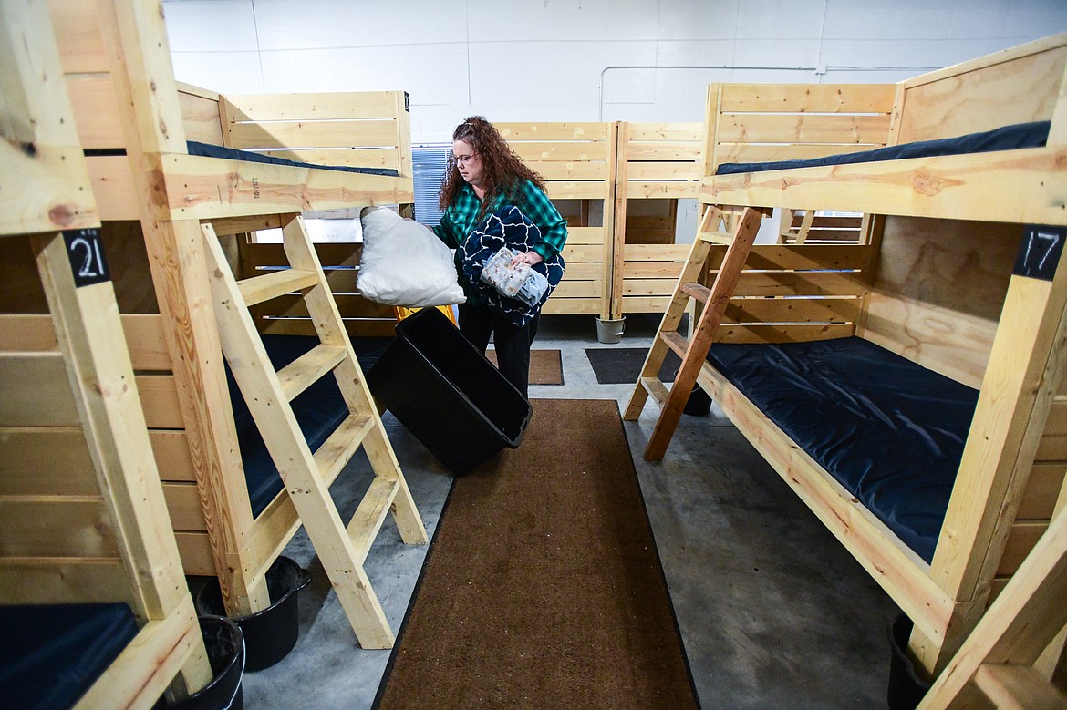Executive Director Tonya Horn collects one of the center's bedding boxes for guests at the Flathead Warming Center in Kalispell on Wednesday, Feb. 1. (Casey Kreider/Daily Inter Lake)