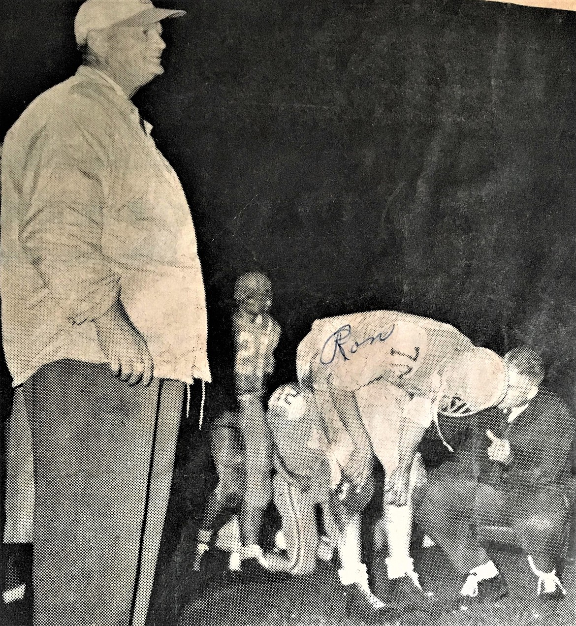 On Oct. 30, 1964, CHS senior lineman Ron Hodge gets instruction from assistant coach Tom Robb, while famed Vik coach Cotton Barlow looks on. Robb, who died Jan. 24, later opened and ran the iconic Iron Horse restaurant.