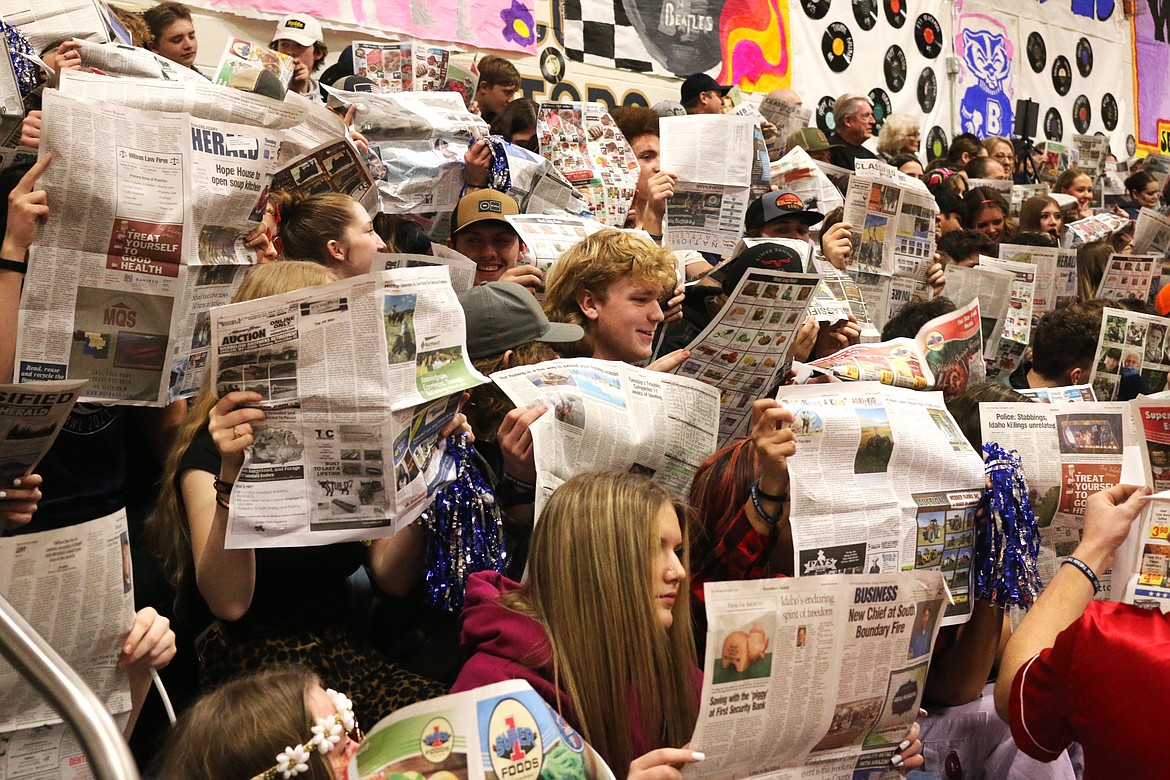 Bonners Ferry student sections busy reading the Herald as the Timberlake Tigers starting lineup is presented at the Backwoods Brawl in 2023.