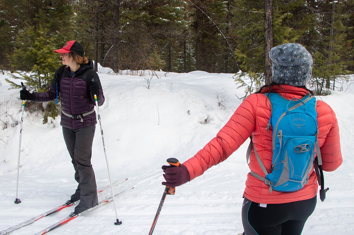 Lydia Kimball, left, and Laurie McCargar, right, are seen while cross country skiing with Outsiety on Jan. 25, 2023 at Round Meadow Trail. (Kate Heston/Daily Inter Lake)