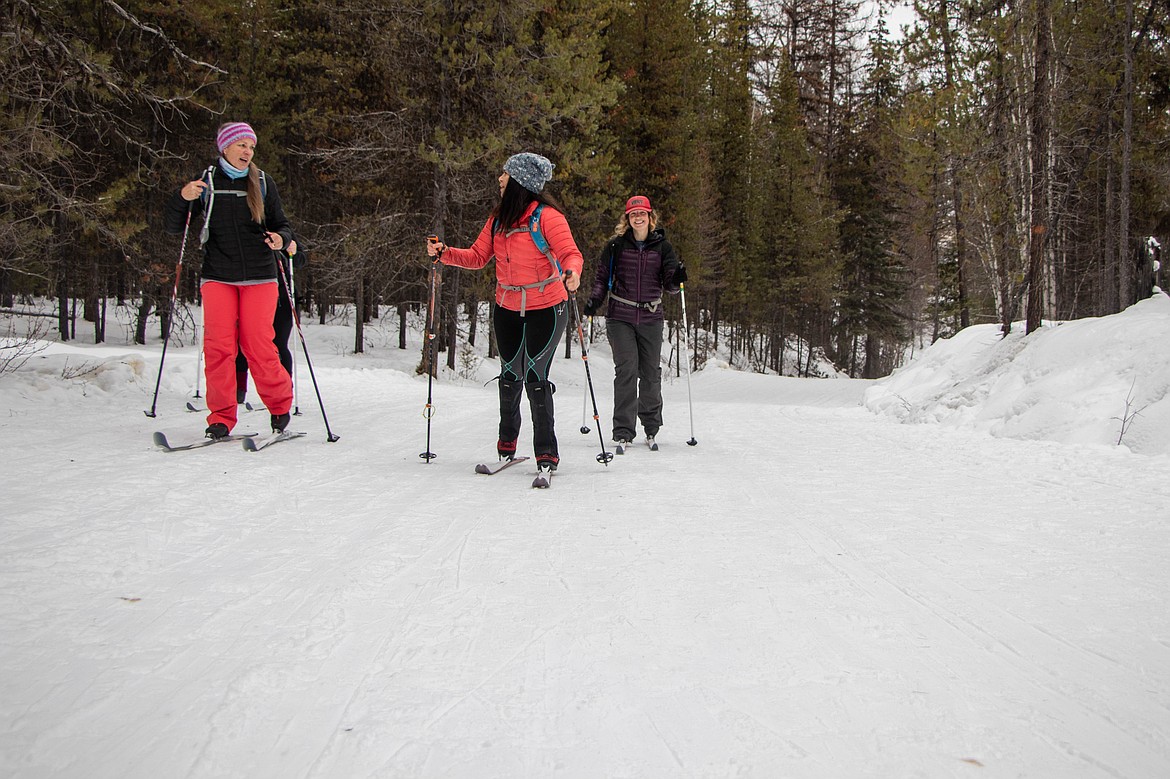 Coral Rogers, left, Laurie McCargar, middle, and Lydia Kimball, right, are seen skiing at Round Meadow Trail on Jan. 25, 2023. (Kate Heston/Daily Inter Lake)