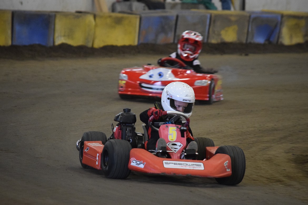 Ben Hindman of Vancouver, Washington, concentrates intently as he enters a curve during Maple Bar Shootout go-kart races on Saturday at the Grant County Fairgrounds and organized by Wenatchee Valley Super Oval.