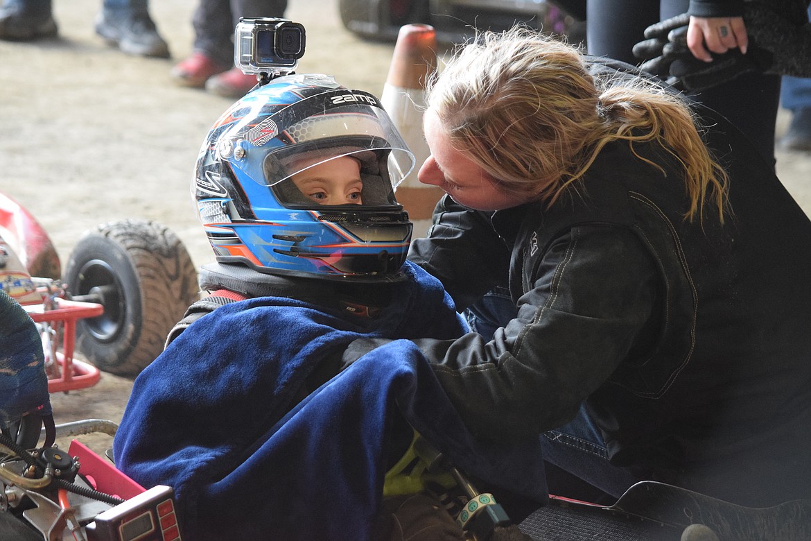 Karly Klein, right, gives encouragement to 5-year-old go-kart racer Bristol Almy as she prepares for her first heat at the Maple Bar Shootout, a series of go-kart races organized by Wenatchee Valley Super Oval at the Grant County Fairgrounds on Saturday.