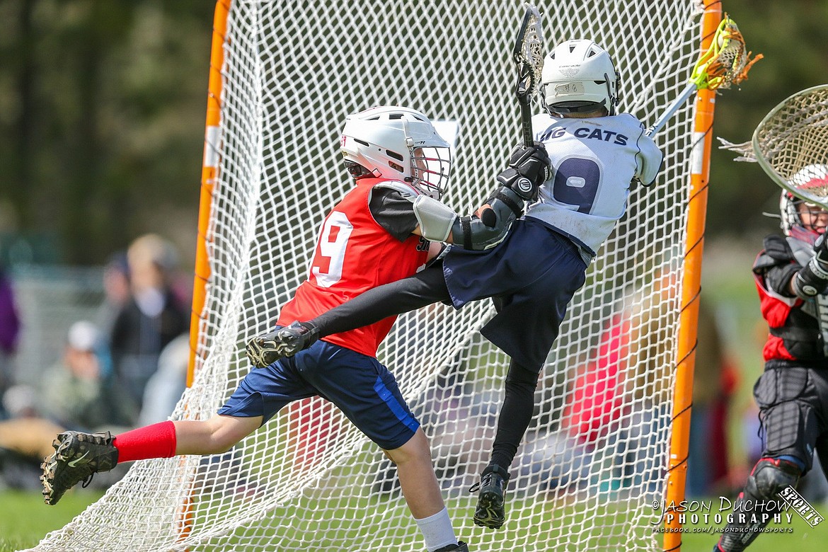 A member of Sandpoint Lacrosse Club's youth boys team defends the net.