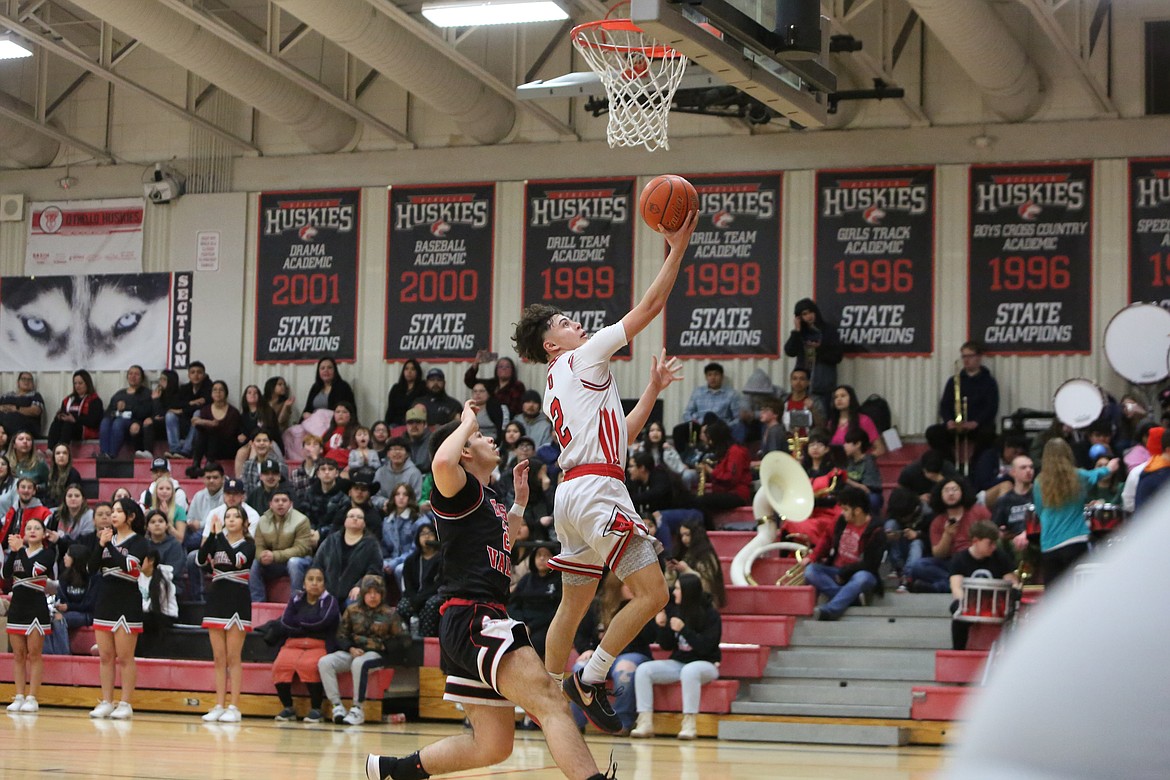 Othello junior Joshua Tovar (2) rises for a layup during a fastbreak in the second quarter of the Huskie’s 57-54 win over East Valley (Yakima) on Tuesday.