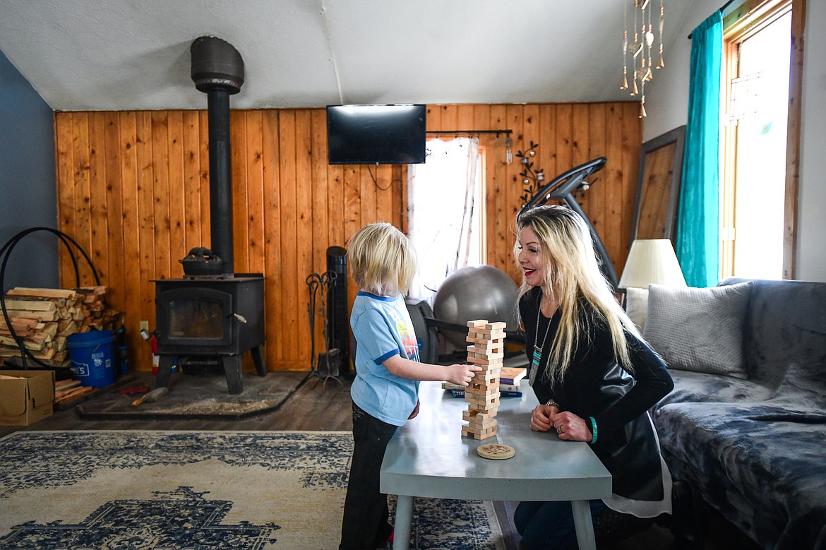 Jessica and her son play a game at their residence in Olney on Thursday, Feb. 2. (Casey Kreider/Daily Inter Lake)