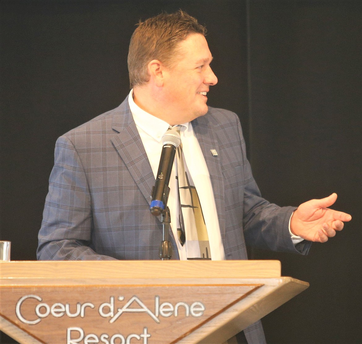 Realtor Greg Rowley speaks during Coldwell Banker Schneidmiller Realty's annual awards banquet on Thursday. Rowley received several awards, including Star Performer.