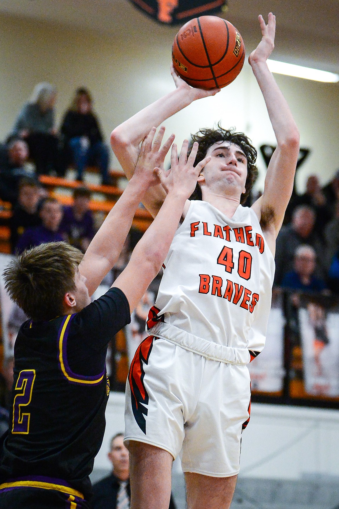 Flathead's Noah Cummings (4) shoots over Missoula Sentinel's Trevor Rausch (2) in the fourth quarter at Flathead High School on Friday, Feb. 3. (Casey Kreider/Daily Inter Lake)