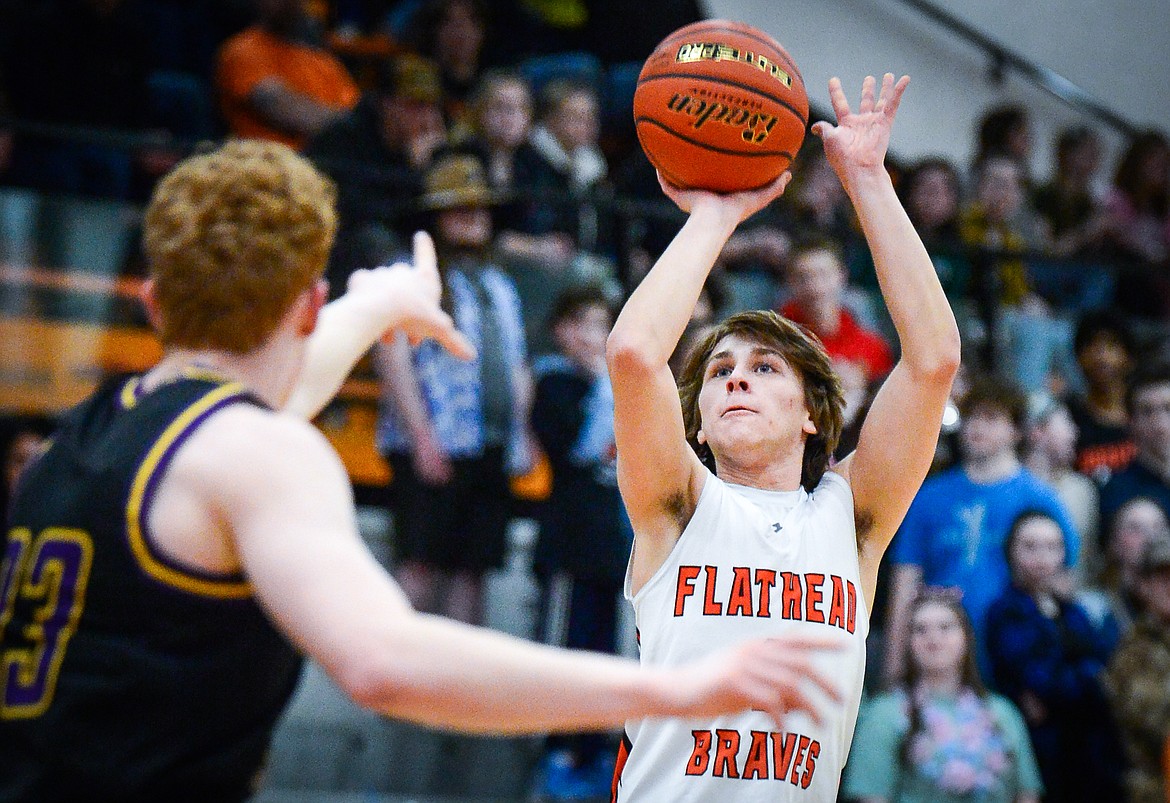 Flathead's Joshua Eagleton (2) shoots a three in the first half against Missoula Sentinel at Flathead High School on Friday, Feb. 3. (Casey Kreider/Daily Inter Lake)