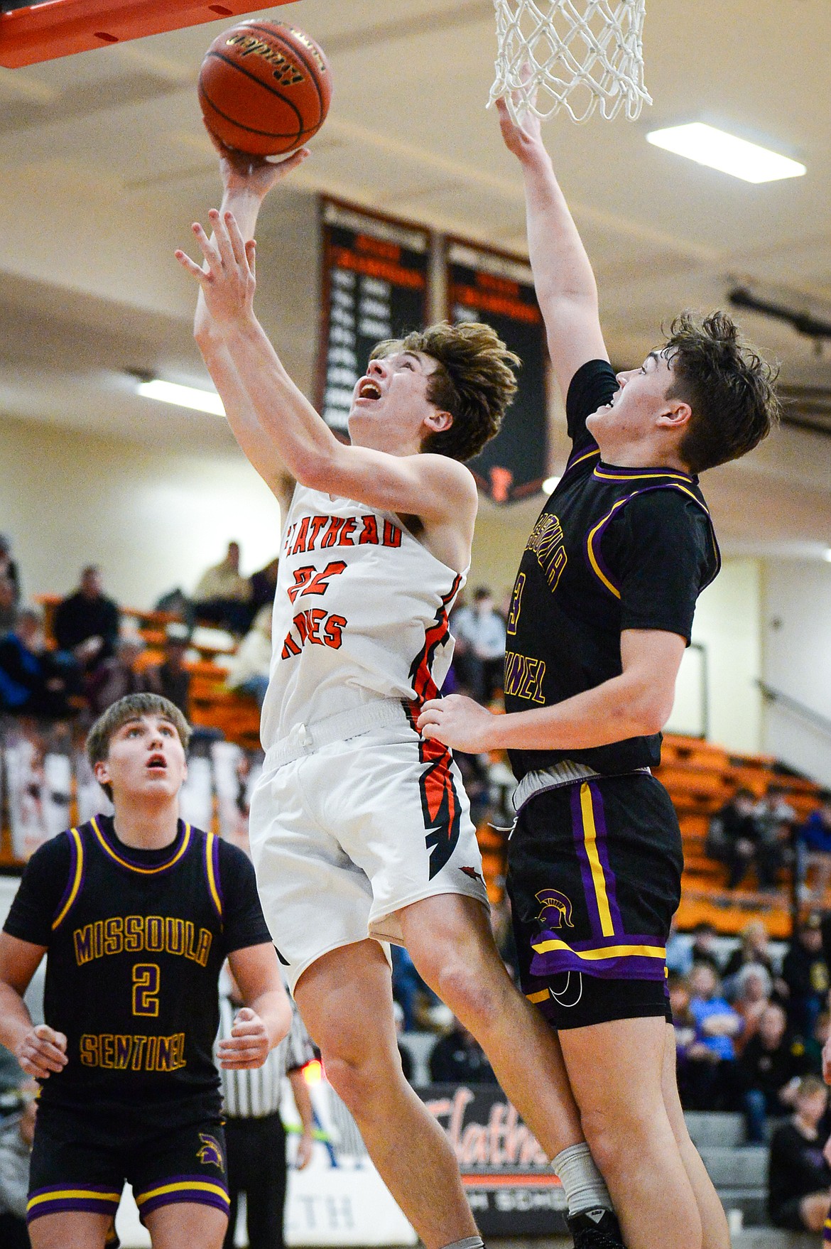 Flathead's Michael Manning (22) goes to the basket in the fourth quarter against Missoula Sentinel at Flathead High School on Friday, Feb. 3. (Casey Kreider/Daily Inter Lake)