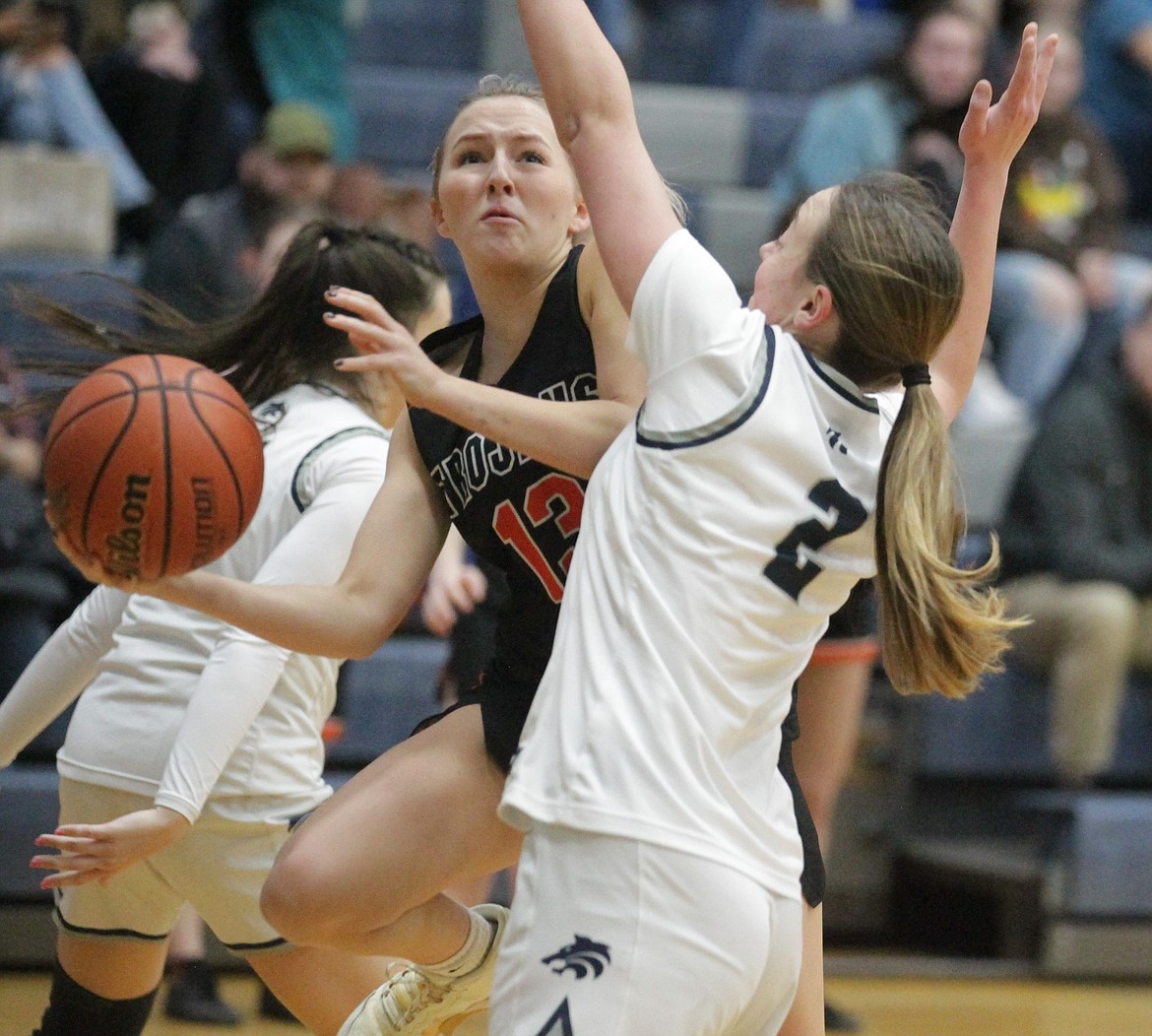 JASON ELLIOTT/Press
Post Falls junior guard Brooklyn Brennan attempts to drive around the defense of Lake City junior guard Kamryn Pickford during the first half of Friday's 5A Region 1 girls basketball opening-round game at Lake City High.