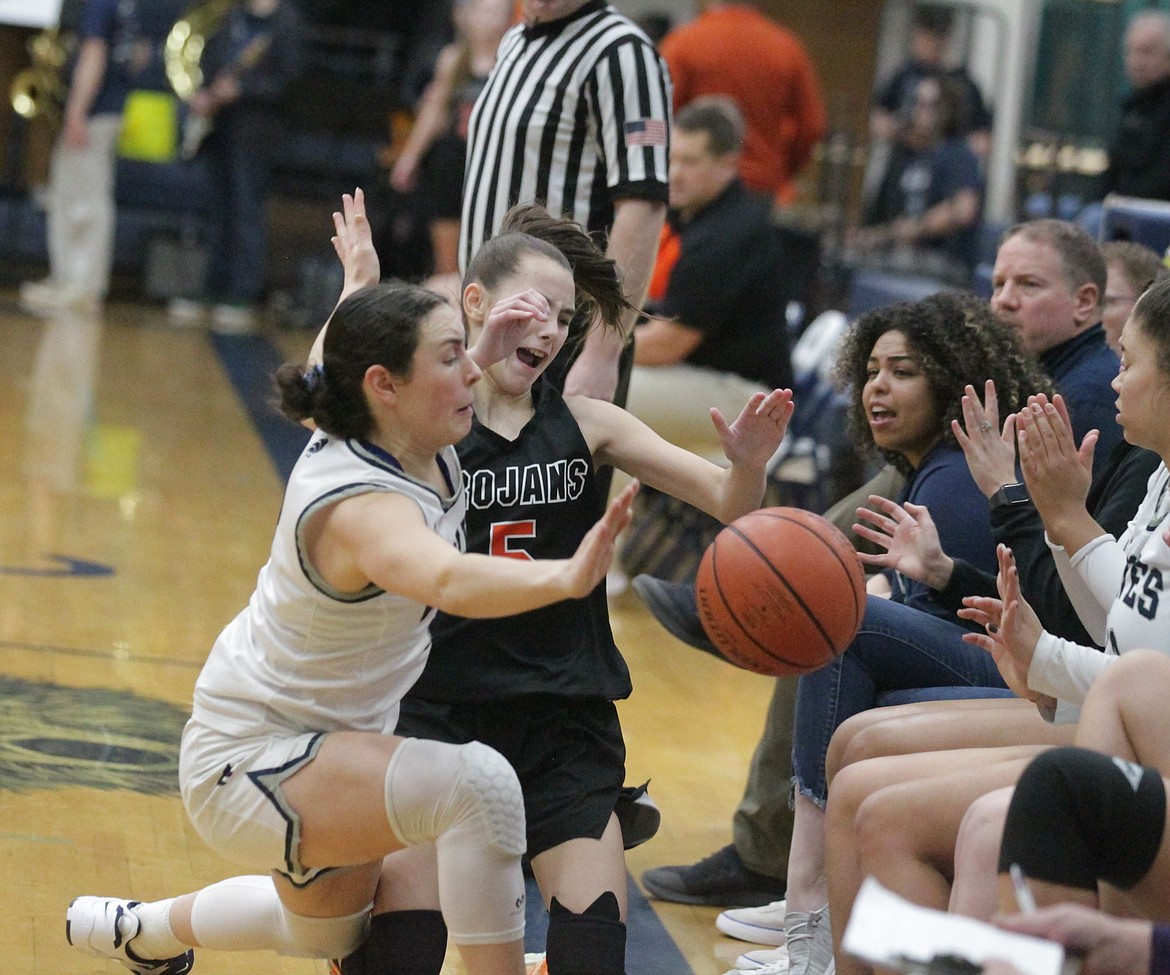 JASON ELLIOTT/Press
Lake City senior guard Allie Bowman (3) and Post Falls freshman guard Kailey Walton (5) battle for the basketball near the Lake City sideline during the first quarter of Friday's game at Lake City High.