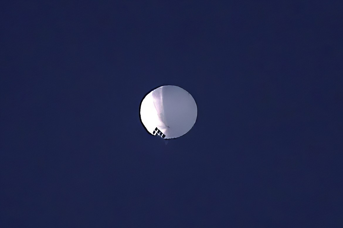 A high altitude balloon floats over Billings, Mont., on Wednesday, Feb. 1, 2023. The U.S. is tracking a suspected Chinese surveillance balloon that has been spotted over U.S. airspace for a couple days, but the Pentagon decided not to shoot it down due to risks of harm for people on the ground, officials said Thursday, Feb. 2, 2023. The Pentagon would not confirm that the balloon in the photo was the surveillance balloon. (Larry Mayer/The Billings Gazette via AP)