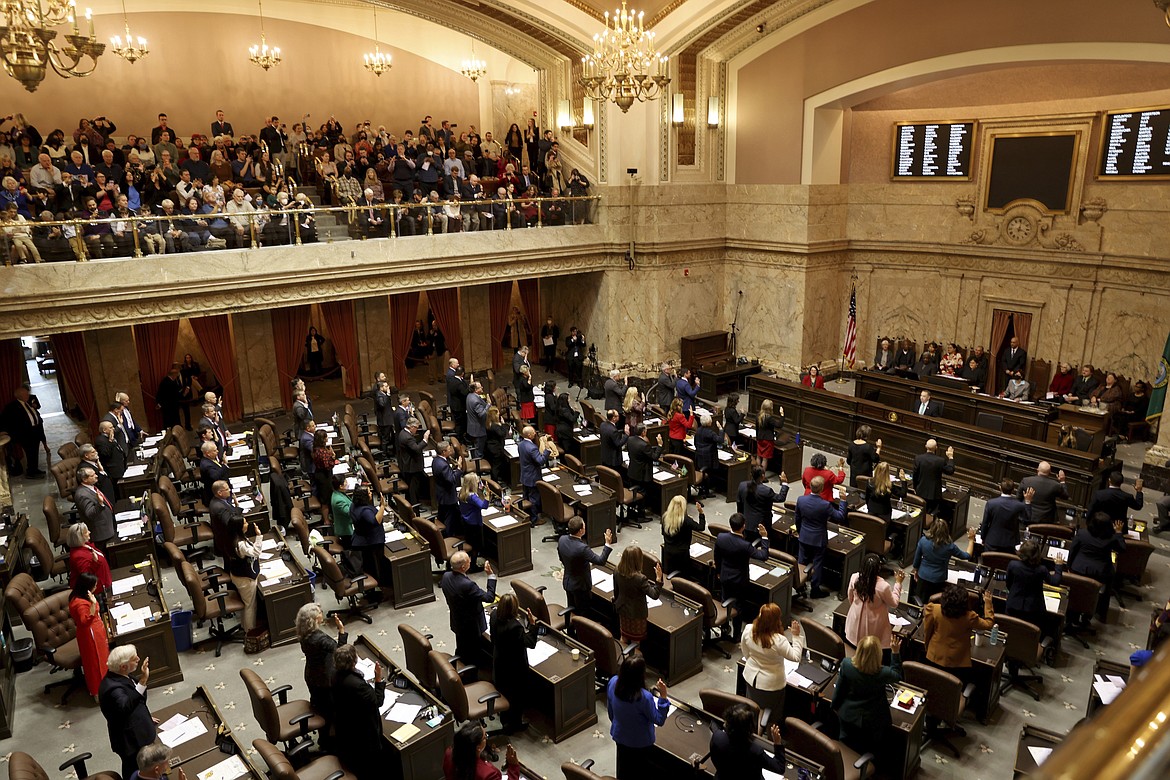 Legislators being sworn in on the first day of the legislative session at the Washington state Capitol in Olympia, Wash., on Monday, Jan. 9, 2023.