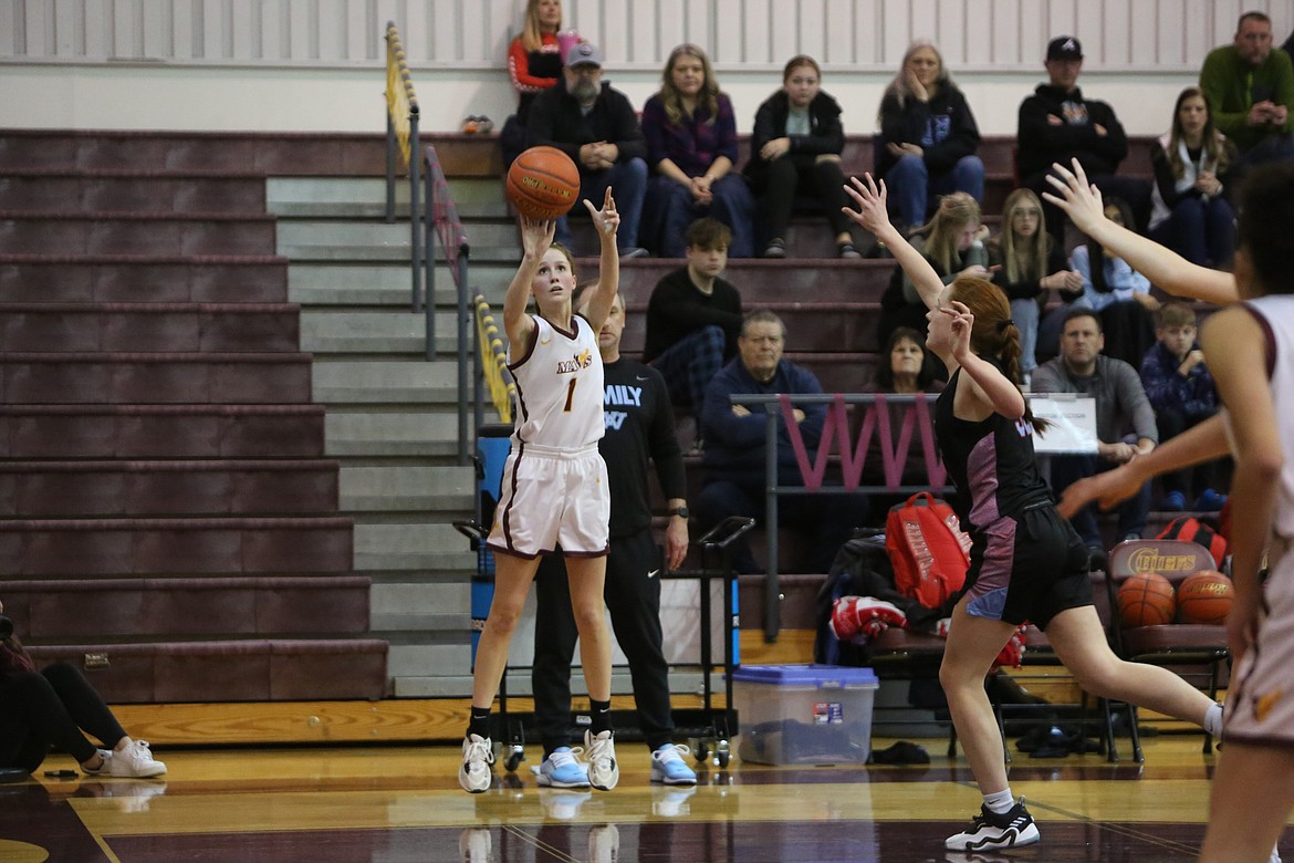 Moses Lake senior Sydney Macdonald, right, gets an open look from three during the first half against West Valley (Yakima). Macdonald set a new career high in scoring, finishing the game with 24 points.