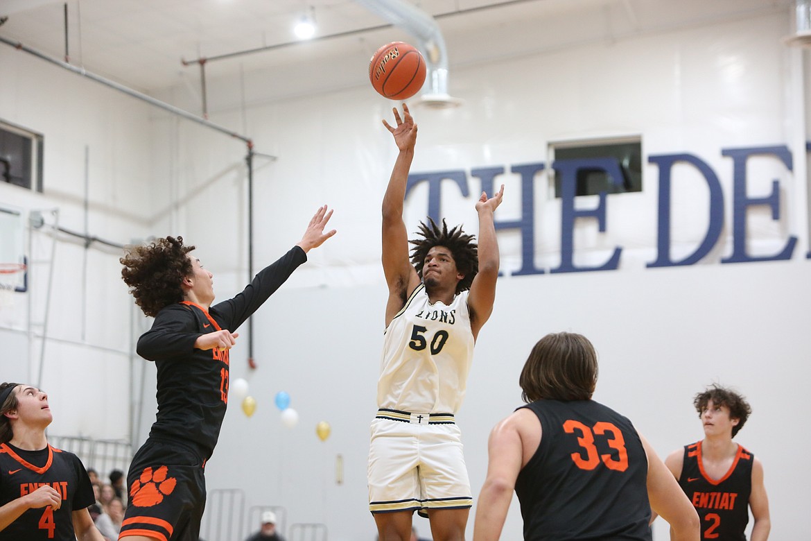 MLCA/CCS junior Caleb Jones takes a jumpshot during the first quarter against Entiat on Friday night. Despite missing part of the game with an injury, Jones tied for the second-most points (16) for the Lions in the win.