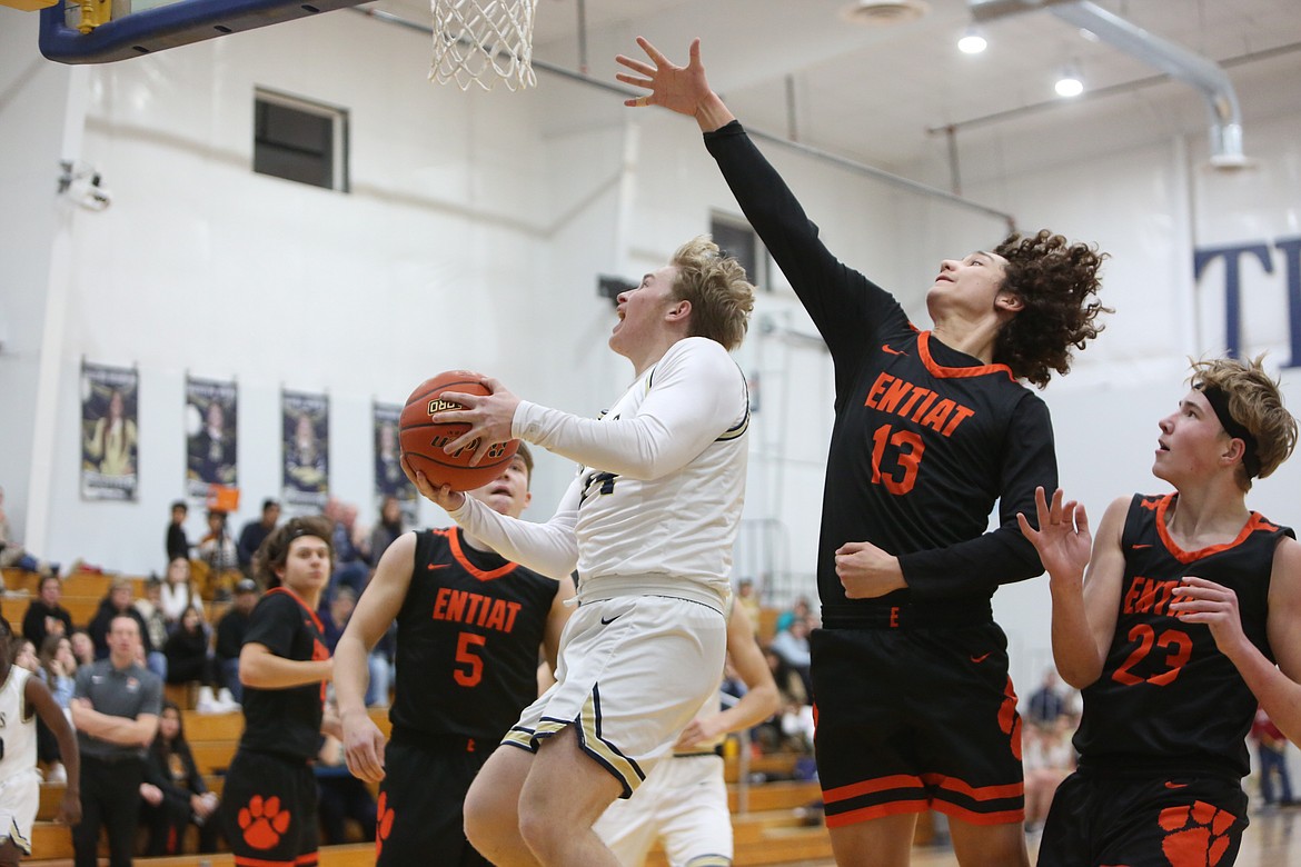 MLCA/CCS junior Jonah Robertson drives to the rim during the first half against Entiat.