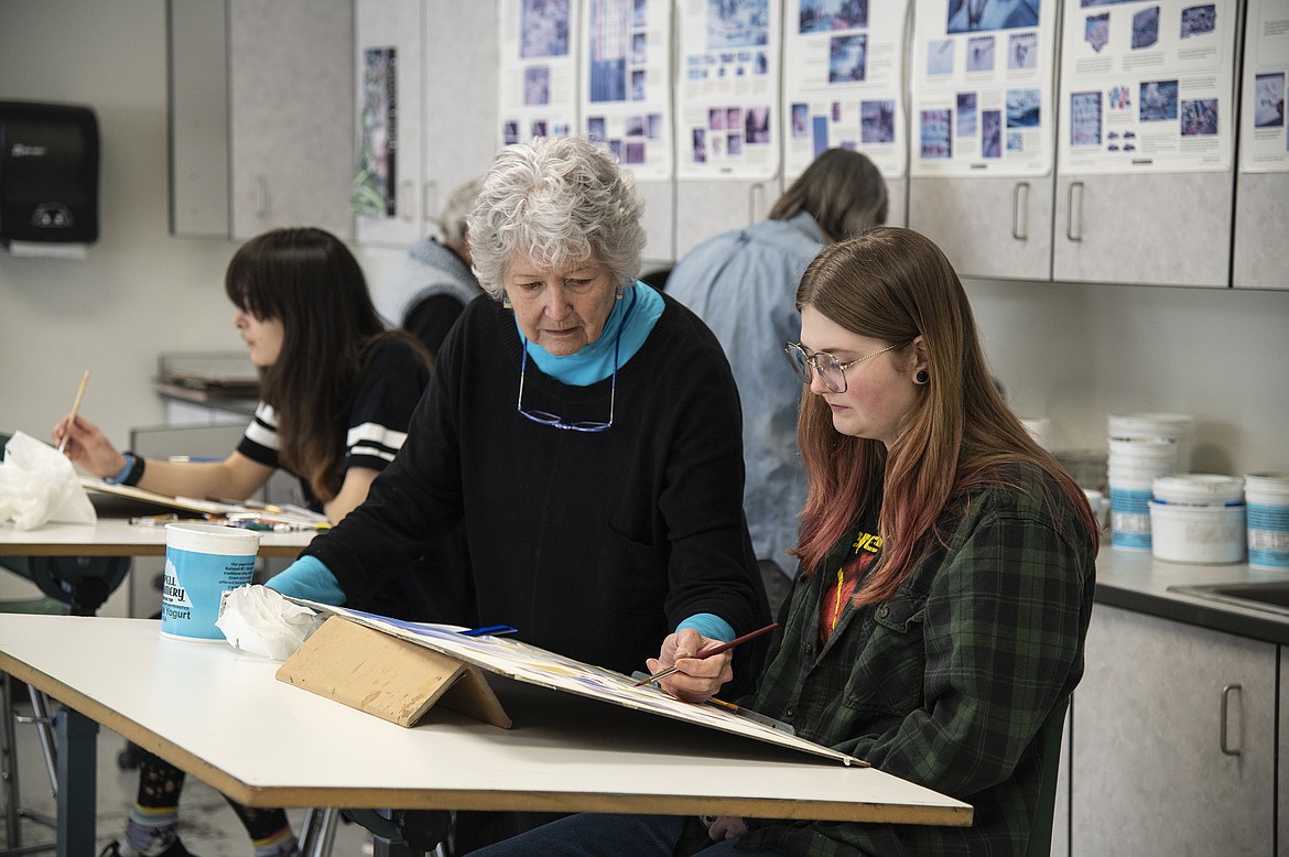 Flathead Valley Community College faculty member Karen Leigh works with an art student during a class. (Photo courtesy of FVCC)