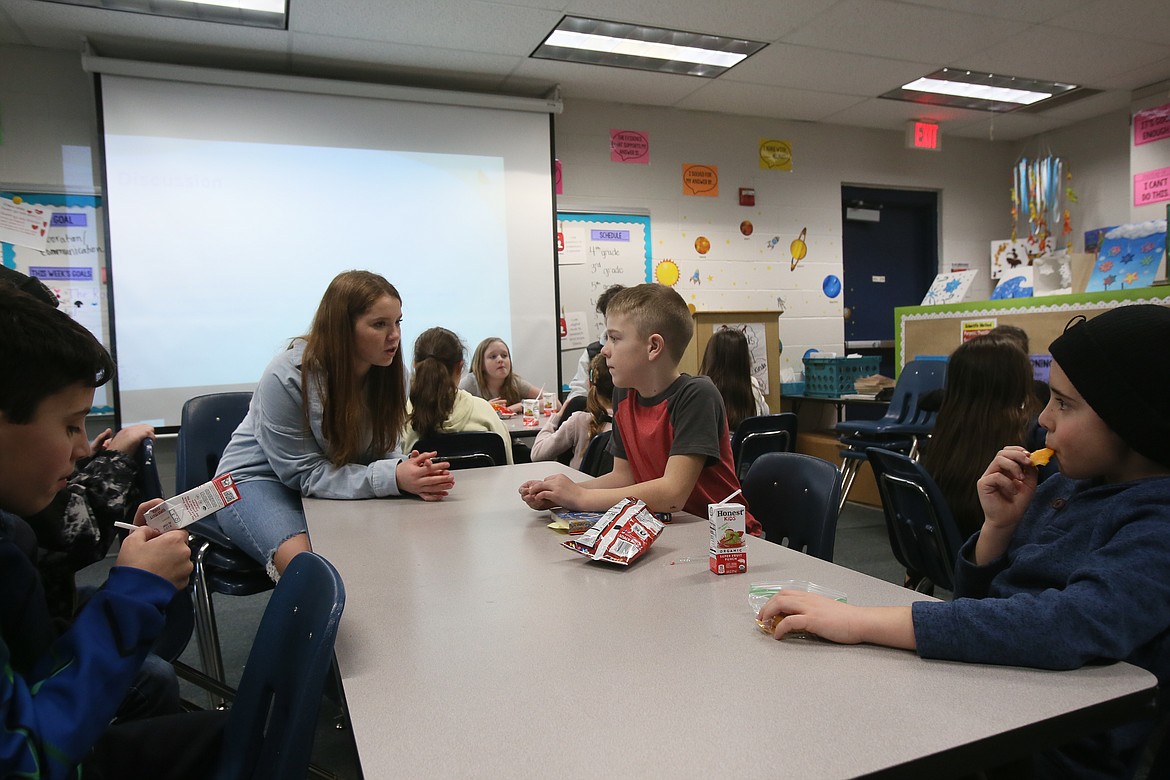 Growing the STEM co-founder and Vice President Adeline Smith engages Skyway Elementary students in a discussion about the book "Solving for M" Monday afternoon during a STEM Book Club meeting.