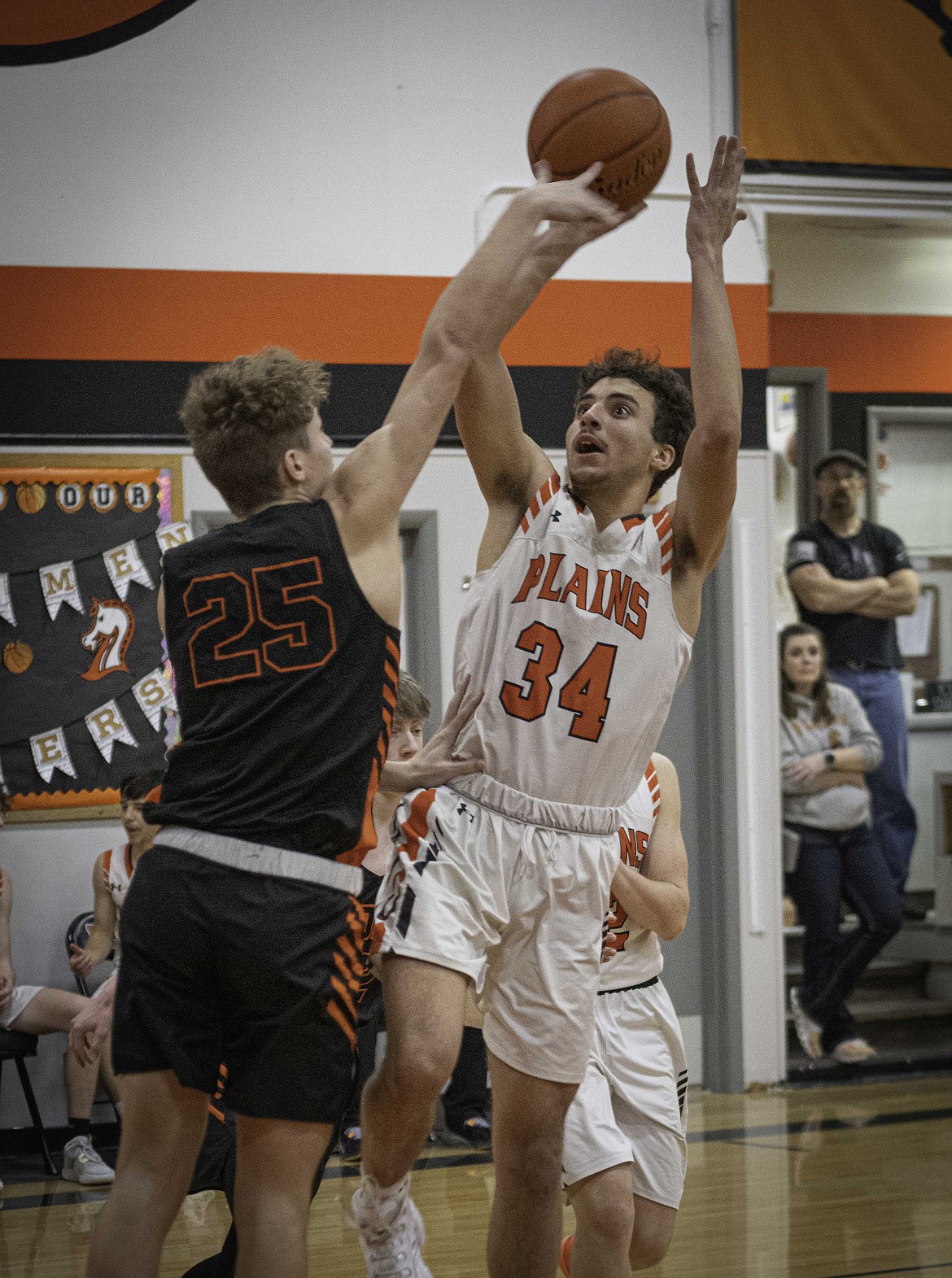 Plains forward Anaya Loberg goes up for a jump shot against Bigfork. (Tracy Scott/Valley Press)