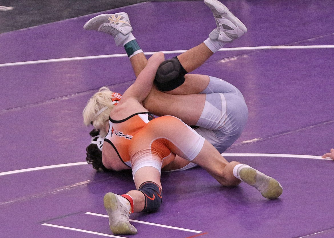 Ronan's Ridge Cote won first place in the 120-pound weight class and recorded four pins. (Bob Gunderson photo)