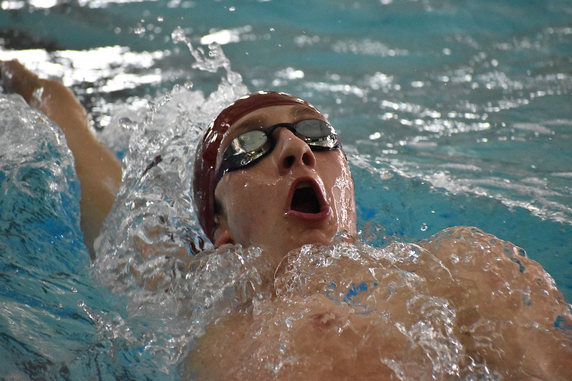 Moses Lake senior Nick Moore swims in the 200-yard Medley Relay Saturday at the district finals. The relay team took second place.