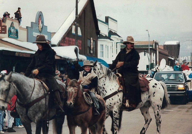 Photo of Pat, Chris, and Jake Nissen at the 1992 Winter Carnival in Whitefish. Jake won the best mounted rider award. Photo courtesy of Pat Nissen.