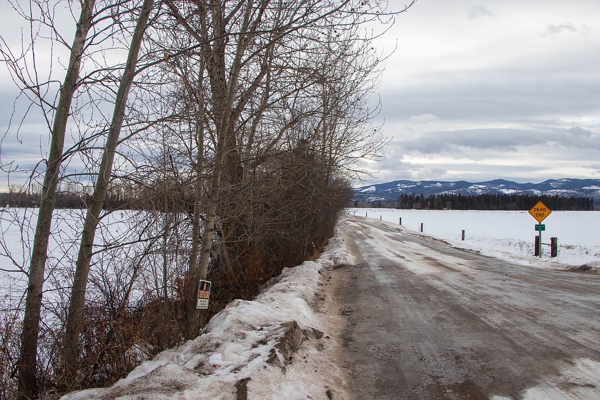 The Half Moon Slough is seen to the left of Siblerud Lane road in Kalispell. Property owners are concerned that continued erosion has brought the water closer and closer to the County Road, according to the petition. (Kate Heston/Daily Inter Lake)