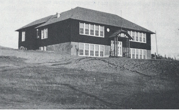 The first Bigfork High School building around 1934, soon after its construction. (Credit – Flathead Lake: From Glaciers to Cherries, R.C. Robbin)