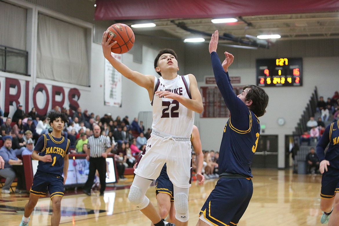 Wahluke sophomore River Buck stretches past a Naches Valley defender to attempt a layup during the second quarter of Wahluke’s 61-39 loss to the Rangers on Tuesday night.