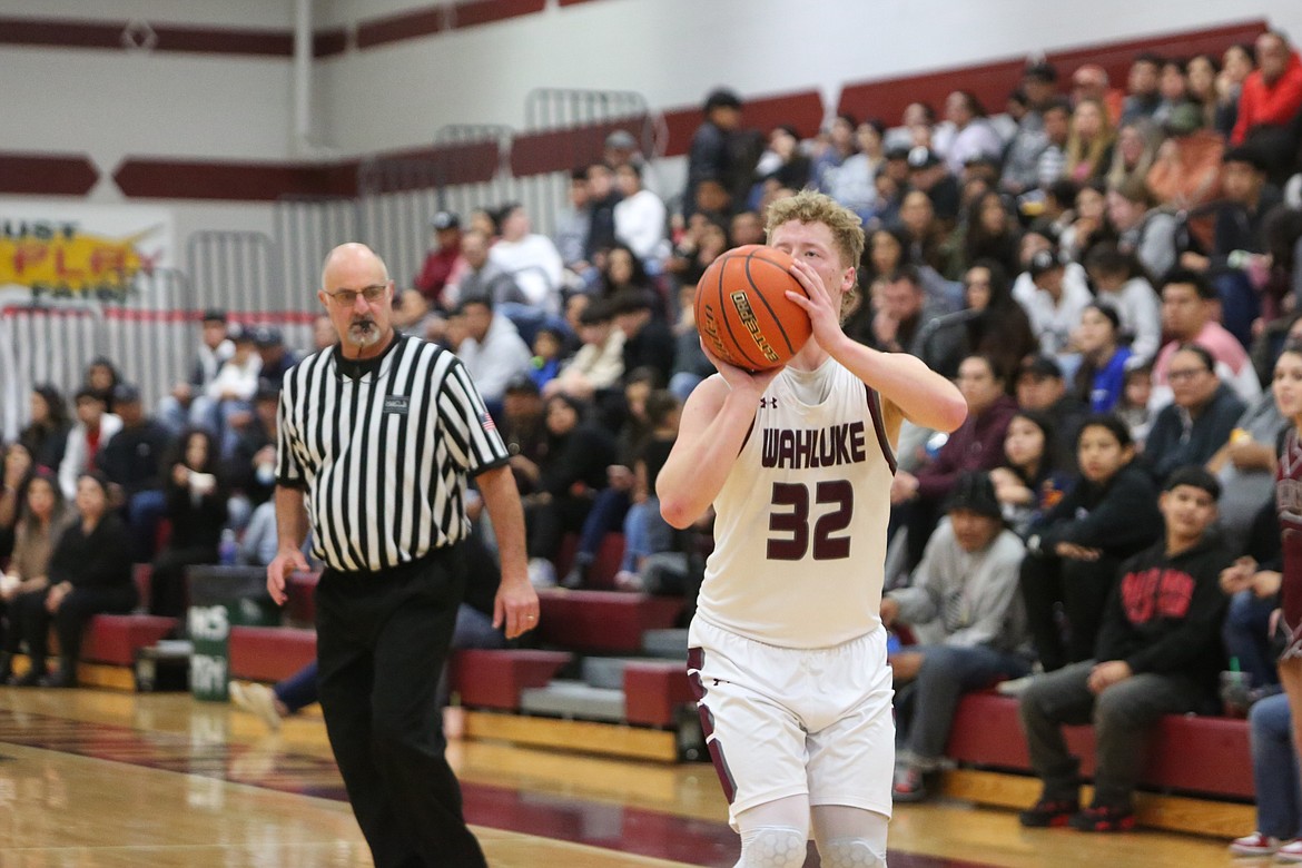 Wahluke junior Andrew Yorgesen attempts a three-pointer during the first half.