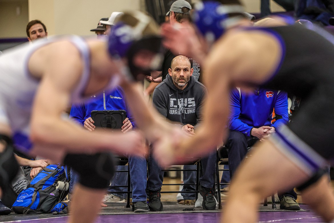 Wrestling head coach Jessie Schaeffer watches his wrestlers compete in Polson at the divisional meet on Saturday. (JP Edge photo)