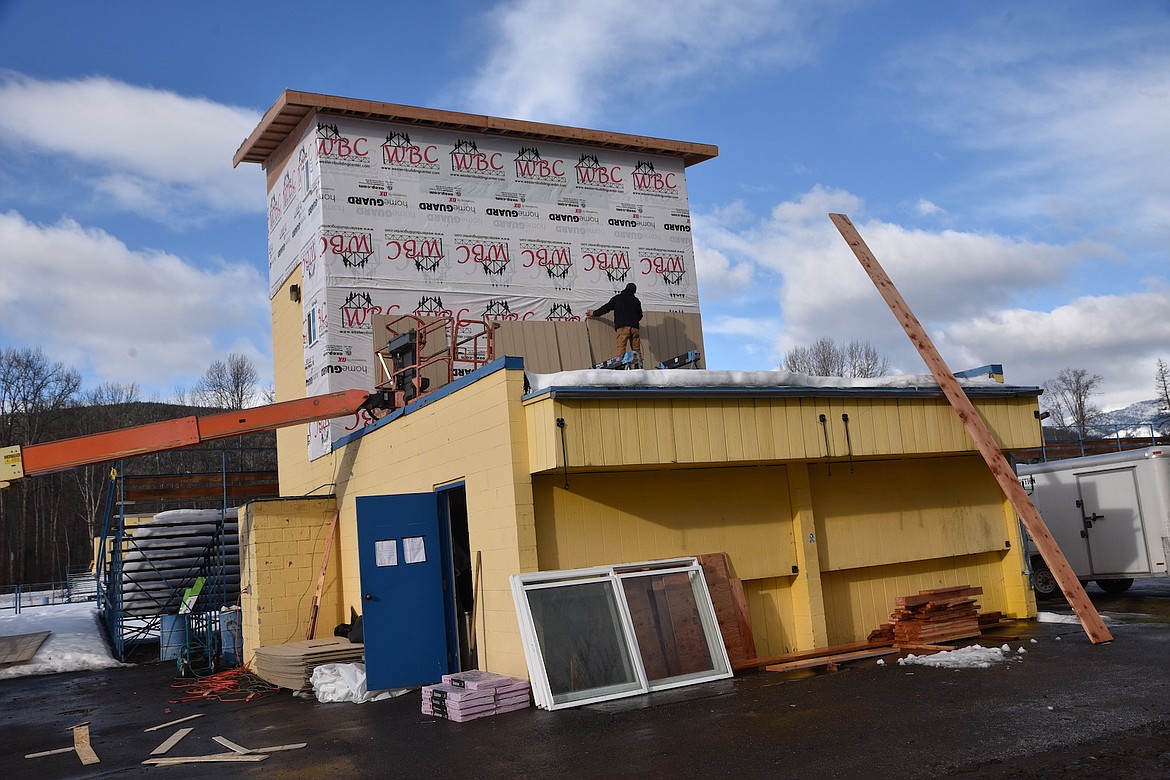 Contractors work on the press box at Logger Stadium Wednesday morning. Libby Public Schools is working on fundraising for various infrastructure projects. (Scott Shindledecker/The Western News)