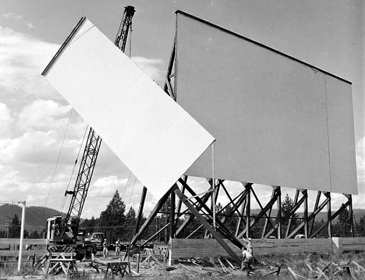 Workers add a panel to the 60-by-60-foot Coeur d'Alene Drive-In screen.