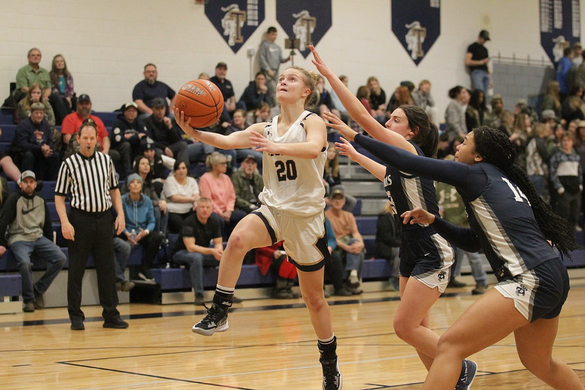 MARK NELKE/Press
Timberlake freshman Malia Miller (20) goes up for a shot against Bonners Ferry in the second half of Game 2 of a best-of-3 series for the 3A District 1 girls basketball title Wednesday night in Spirit Lake.