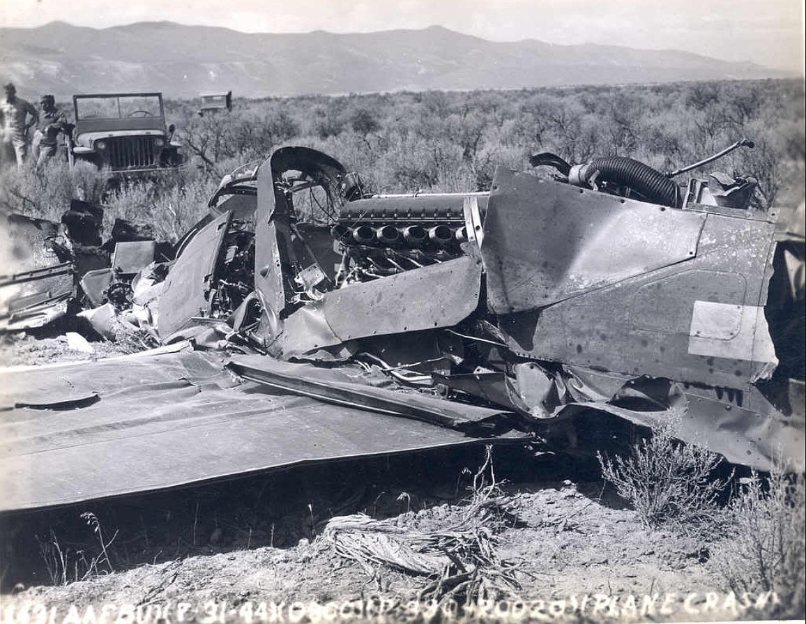 This photo shows the wreckage of a P-39Q which crashed near Wahatis Peak. The pilot, Robert M. Pickerall, was killed in the crash on July 31, 1944. According to the National Museum of the U.S. Air Force, the P-39Q cost about $46,000 at the time and had a maximum speed of 376 miles per hour and could fly up to 35,000 feet in elevation. It was manufactured by Bell Aircraft in the early 1940s. Engine placement behind the cockpit could lead to difficulties for inexperienced pilots.