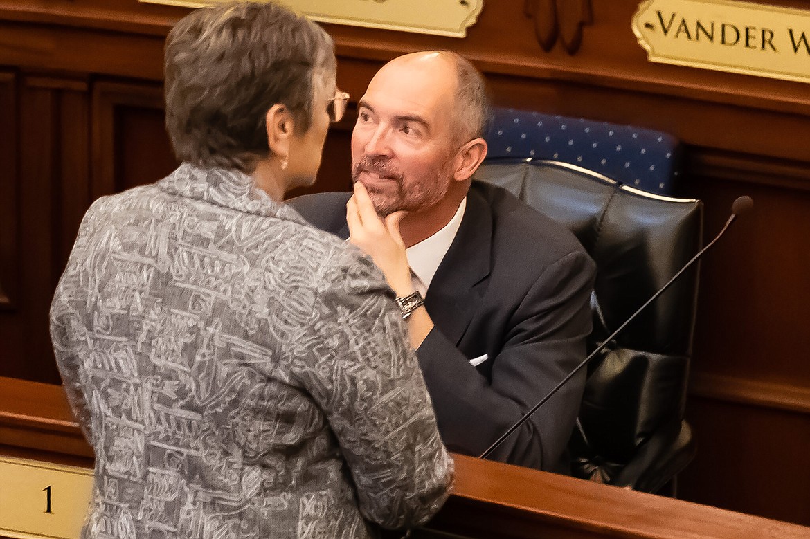 Assistant Majority Leader Idaho Rep. Sage G. Dixon, R-Ponderay, talks with fellow lawmakers at the State Capitol in Boise on Jan. 9, 2023.