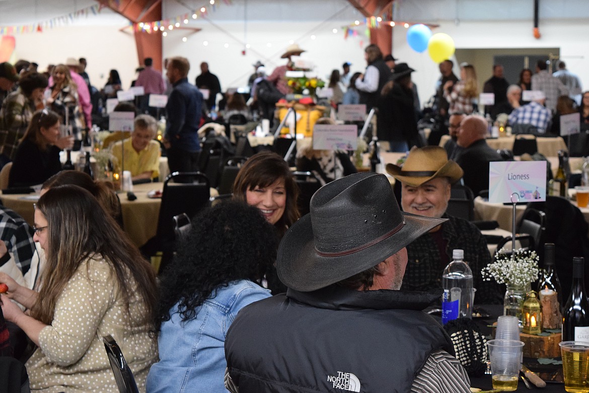 Attendees enjoy a meal at the Columbia Basin Cancer Foundation’s Country Sweethearts event on Feb. 4. The crowd was filled with smiles as they joined together to support those dealing with challenging diagnoses.